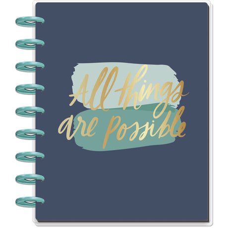 Notebook with 'All things are possible' text on a blue background