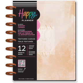 Happy Planner budget planner with textured canvas cover and pink and gold design.