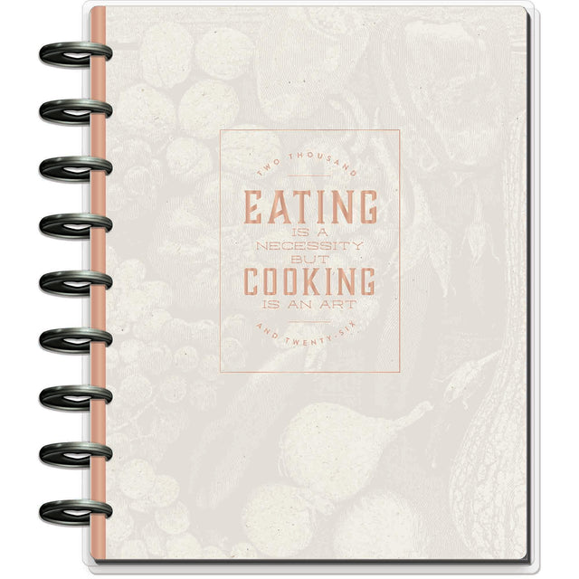 Notebook with decorative cover and spiral binding on a white background