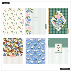 Collection of stationery items with floral and butterfly patterns on a white background