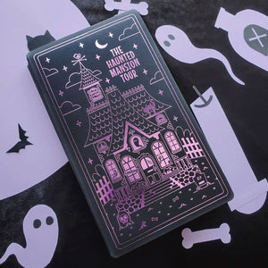 STICKII Halloween Advent Calendar featuring a haunted mansion design on a black background, complete with ghost and bat illustrations.