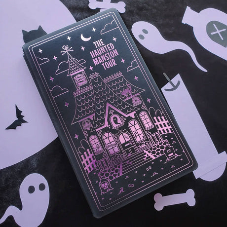 STICKII Halloween Advent Calendar featuring a haunted mansion design on a black background, complete with ghost and bat illustrations.