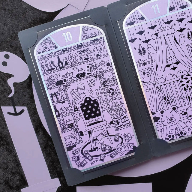 Halloween-themed STICKII with black and white designs on a dark surface.