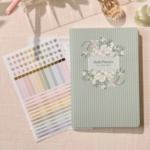 Erin Condren Petite Planner: Quarterly planner cover beside included sticker sheets