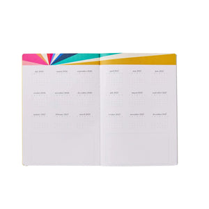 Erin Condren Petite Planner: Open monthly calendar pages beneath a colourful header