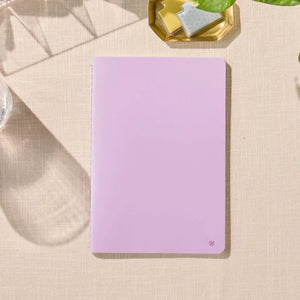 Erin Condren Petite Journal: Closed lilac journal on a desk